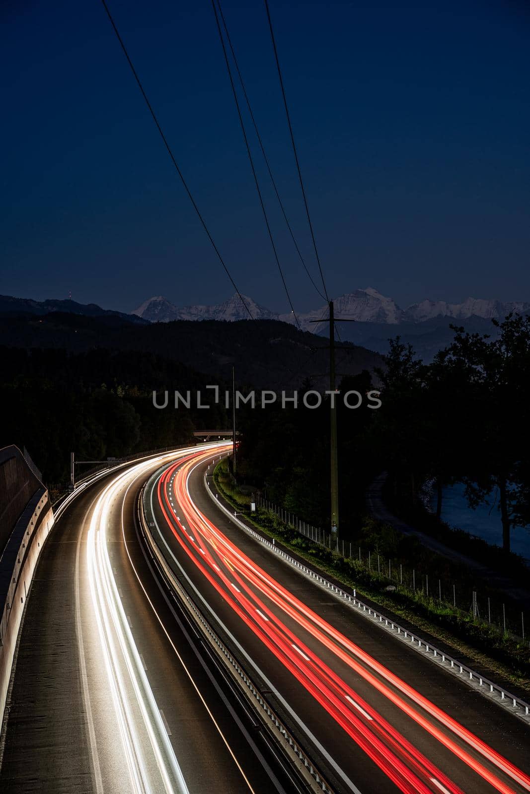 long exposure of highway with Eiger, Moench and Jungfrau in the background.