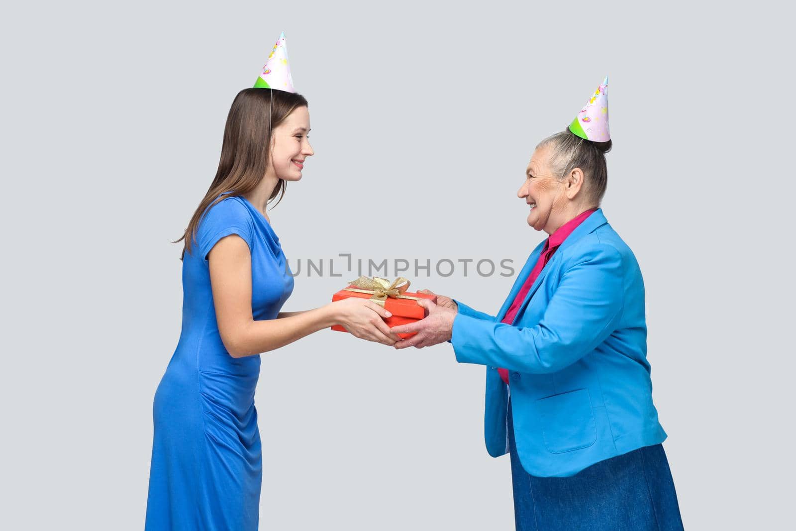 Young woman gives a gift to old funny woman by Khosro1