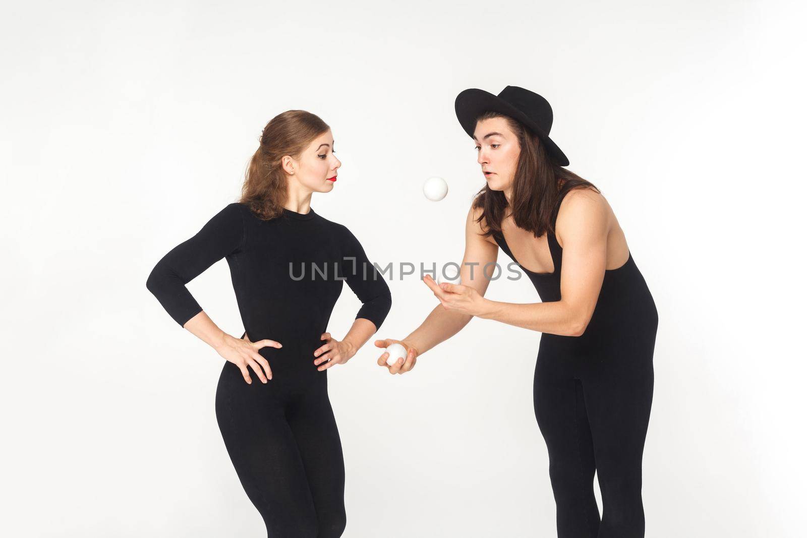 Artist demonstrate juggling richly woman. Studio shot