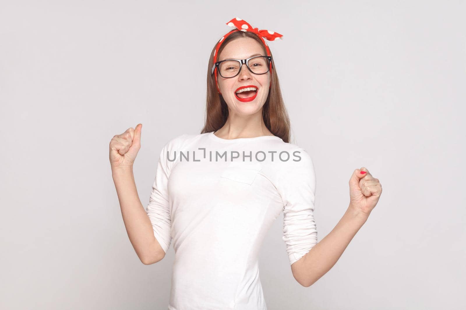 woman in white t-shirt with freckles, black glasses, red lips and head band. by Khosro1