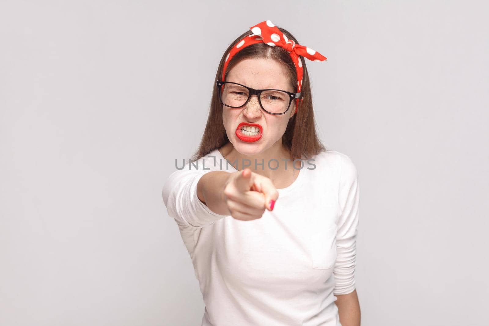 woman in white t-shirt with freckles, glasses, red lips and head band. by Khosro1