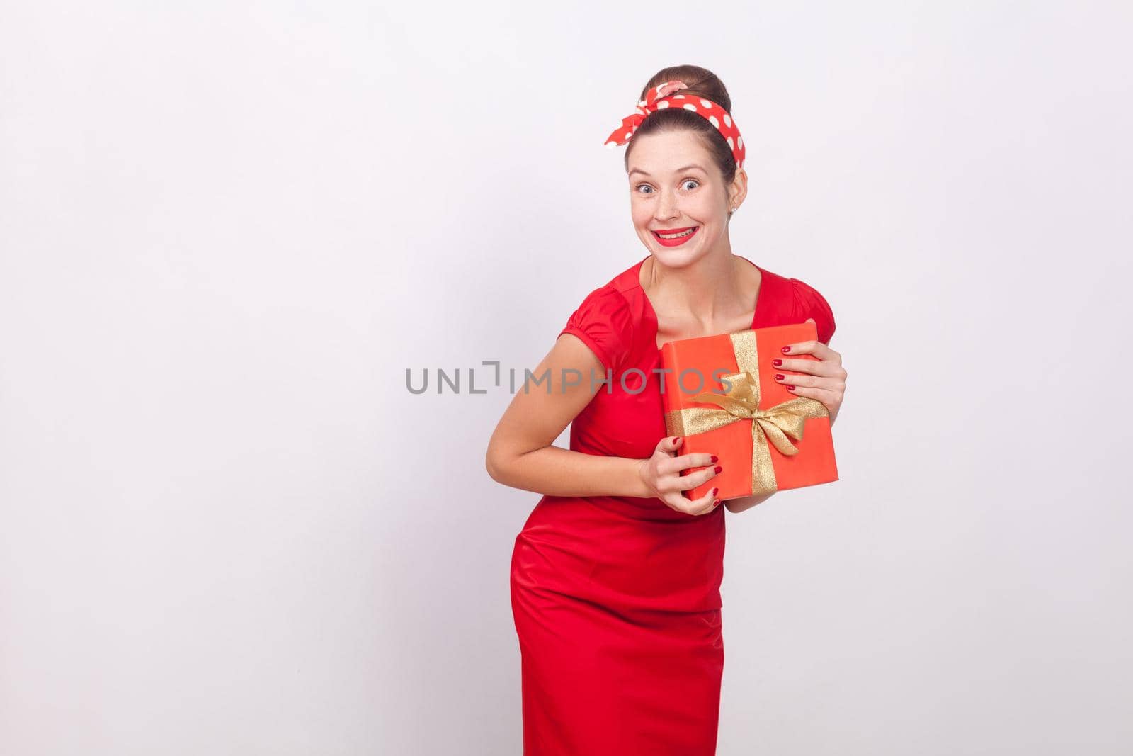 Wonder and happy woman holding gift box by Khosro1