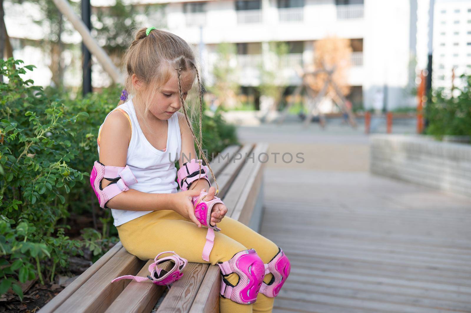 Little girl learns to roller skate outdoors. by mrwed54