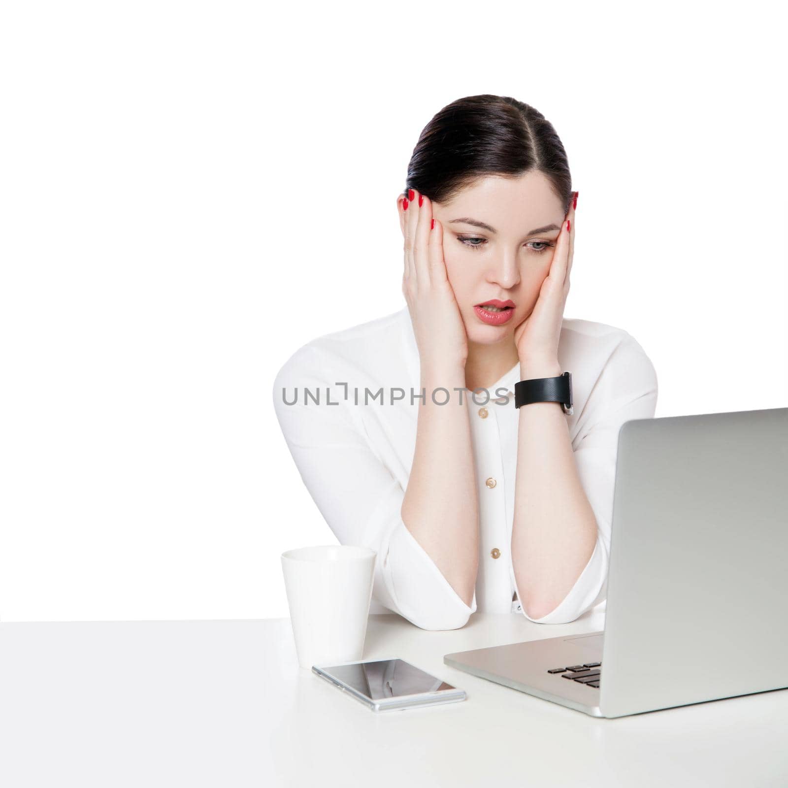 Portrait of shocked attractive brunette businesswoman in white shirt sitting looking at laptop display, reading unbelievable news and confused. indoor studio shot, isolated in white background.