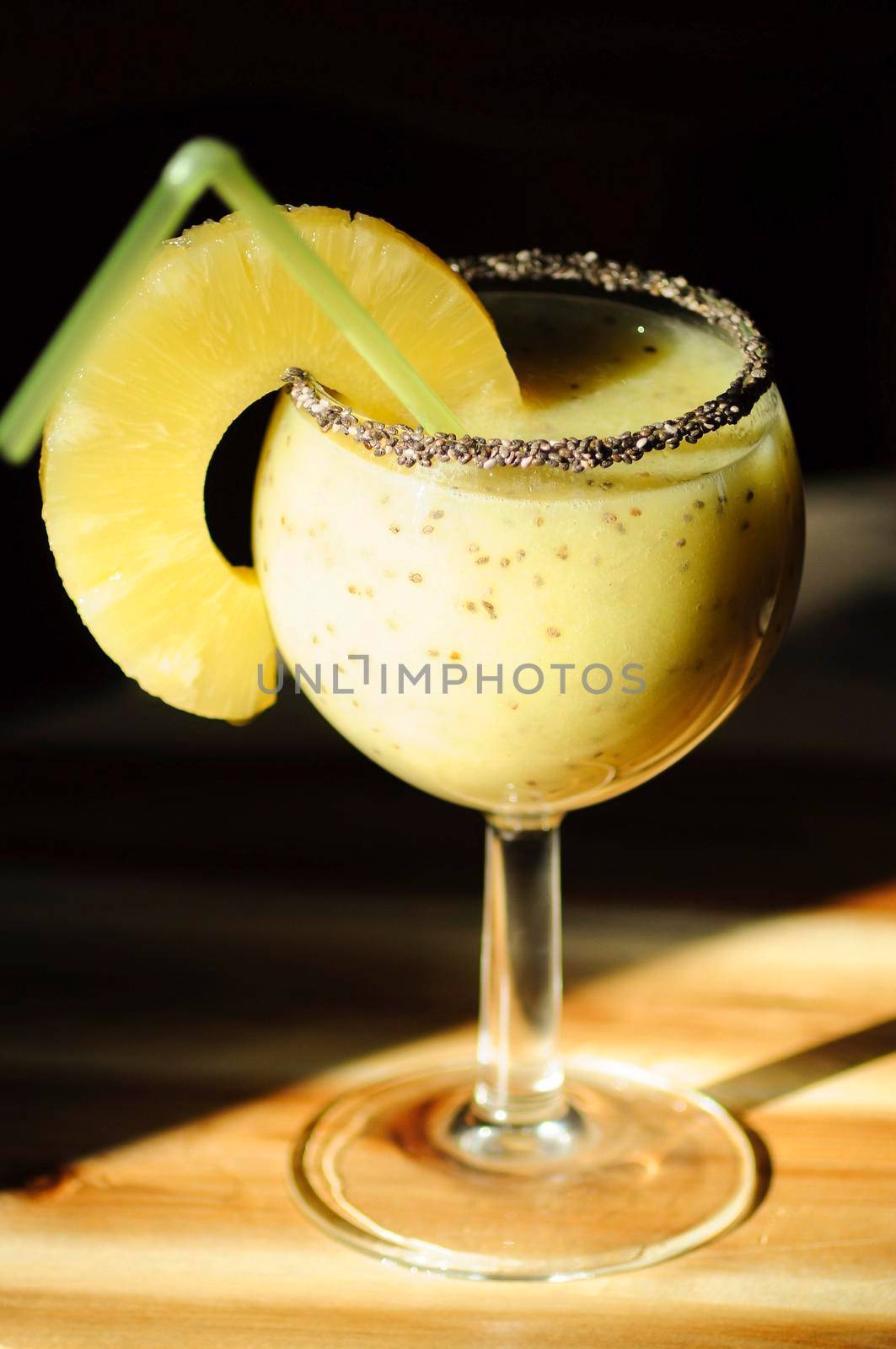 bright yellow breakfast smoothie with pineapple, kiwi and chia seeds on a dark background, healthy eating, still life, High quality photo