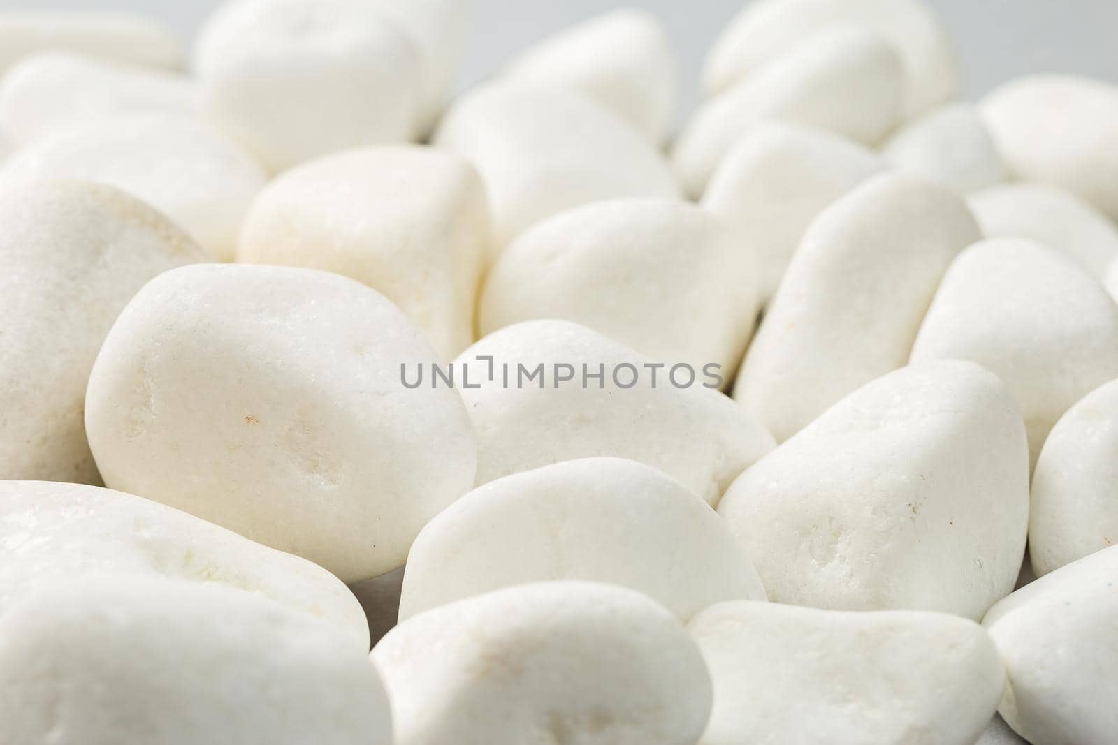 White rock on the grey background. Decorative stone natural material