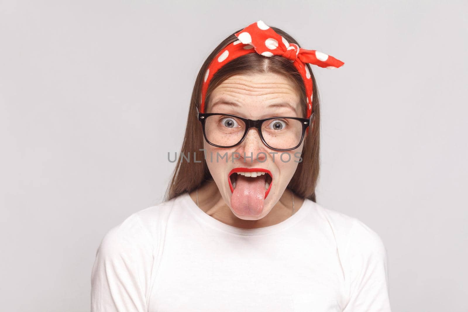 tongue out of surprised, or shocked crazy emotional young woman by Khosro1