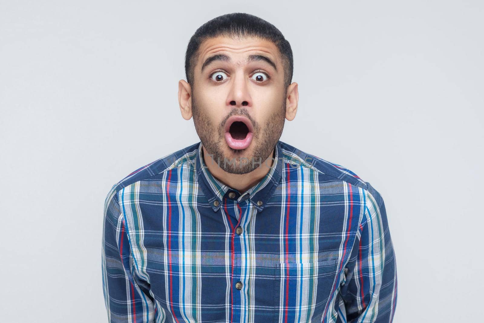 Wow! Portrait of businessman with shocked facial expression. Studio shot