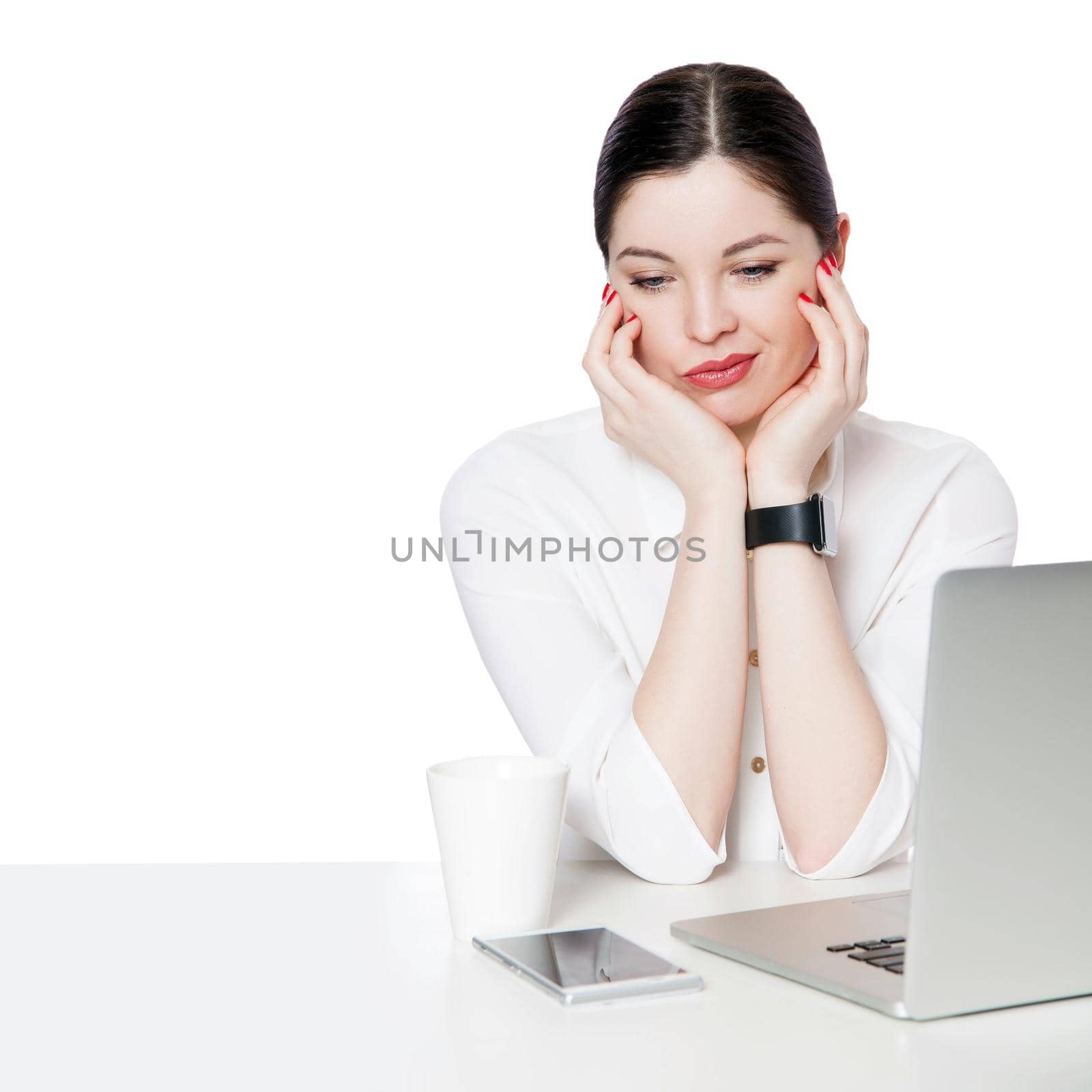 Portrait of dissatisfied or sad brunette businesswoman in white shirt sitting with laptop touching her face and thinking or confused and thinking. indoor studio shot, isolated in white background.