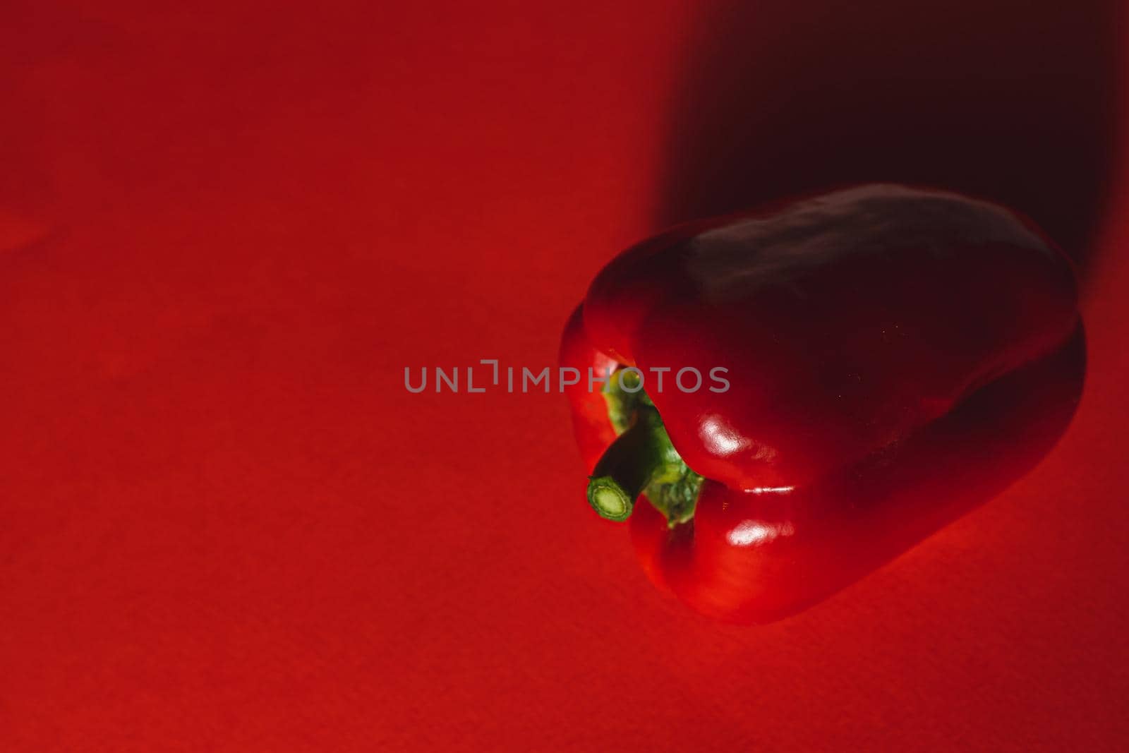 SWEET PEPPER ON A RED BACKGROUND