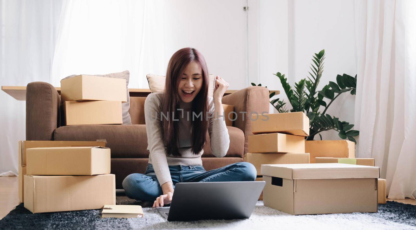 Portrait of Starting small businesses SME owners female entrepreneurs working on receipt box and check online orders to prepare to pack the boxes, sell to customers, SME business ideas online..