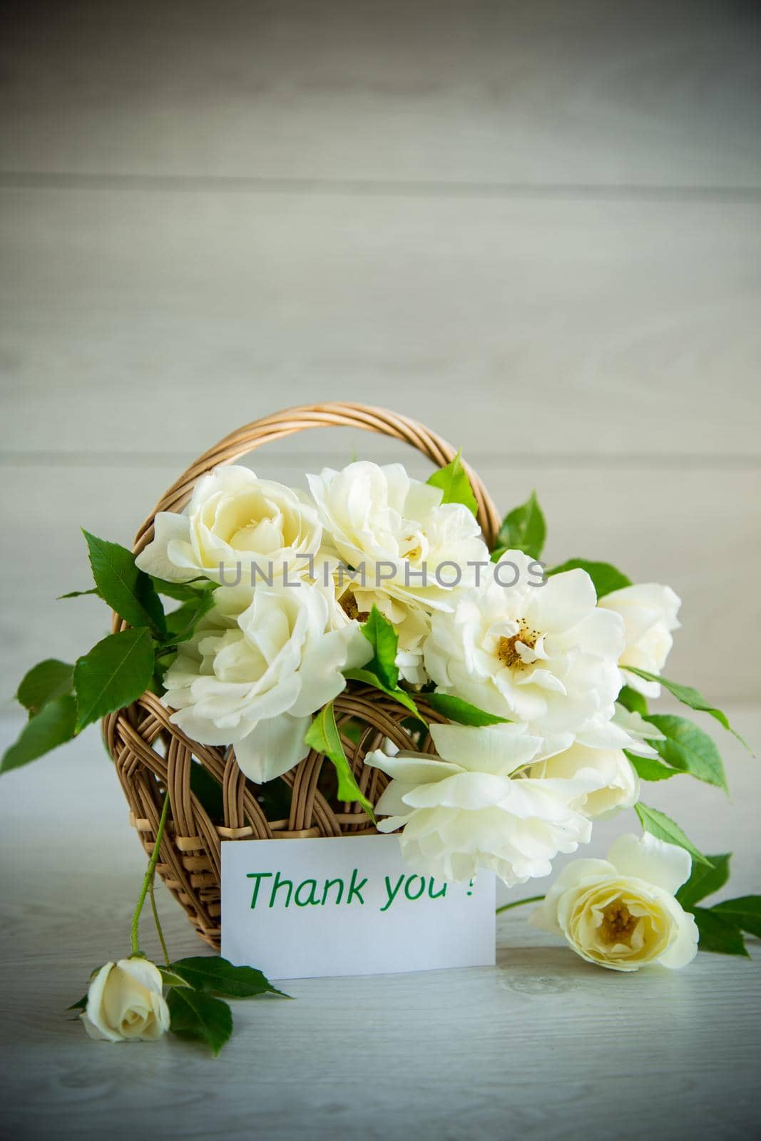 bouquet of beautiful white roses on a wooden table