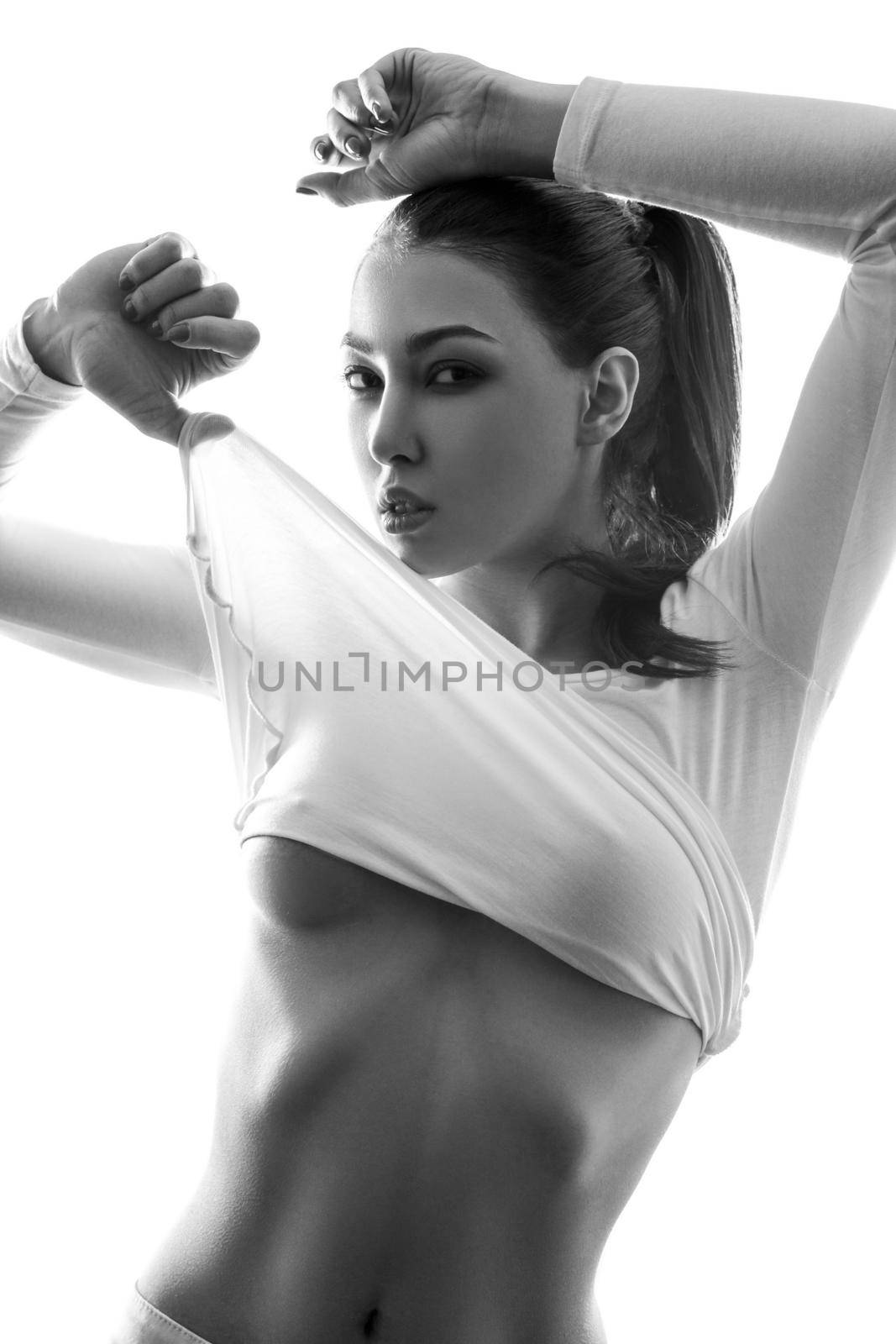 Sexy fashion model posing in white t-shirt and undressing. by Khosro1