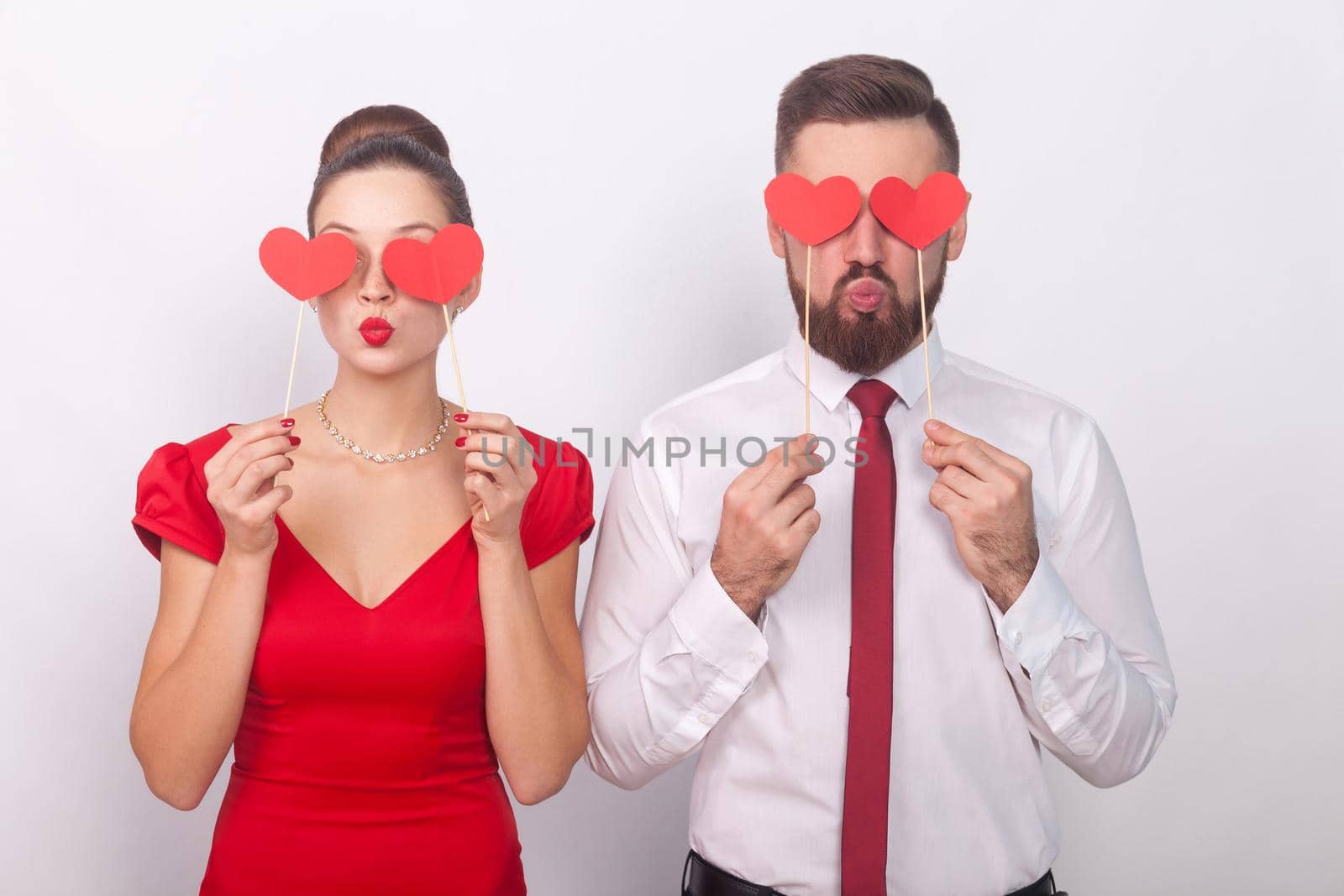 Handsome couple holding decorative sign love, heart symbol by Khosro1