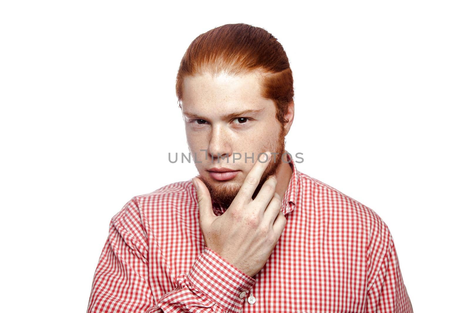 Bearded businessman with red shirt looking at camera. studio shot isolated on white..