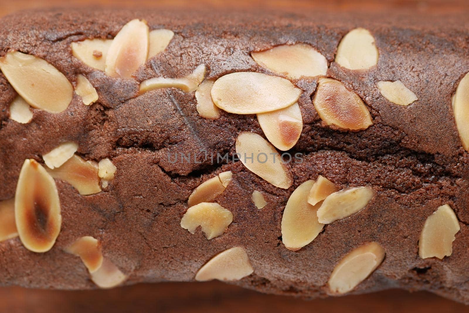 slice of bakery fruit cake on chopping board ,