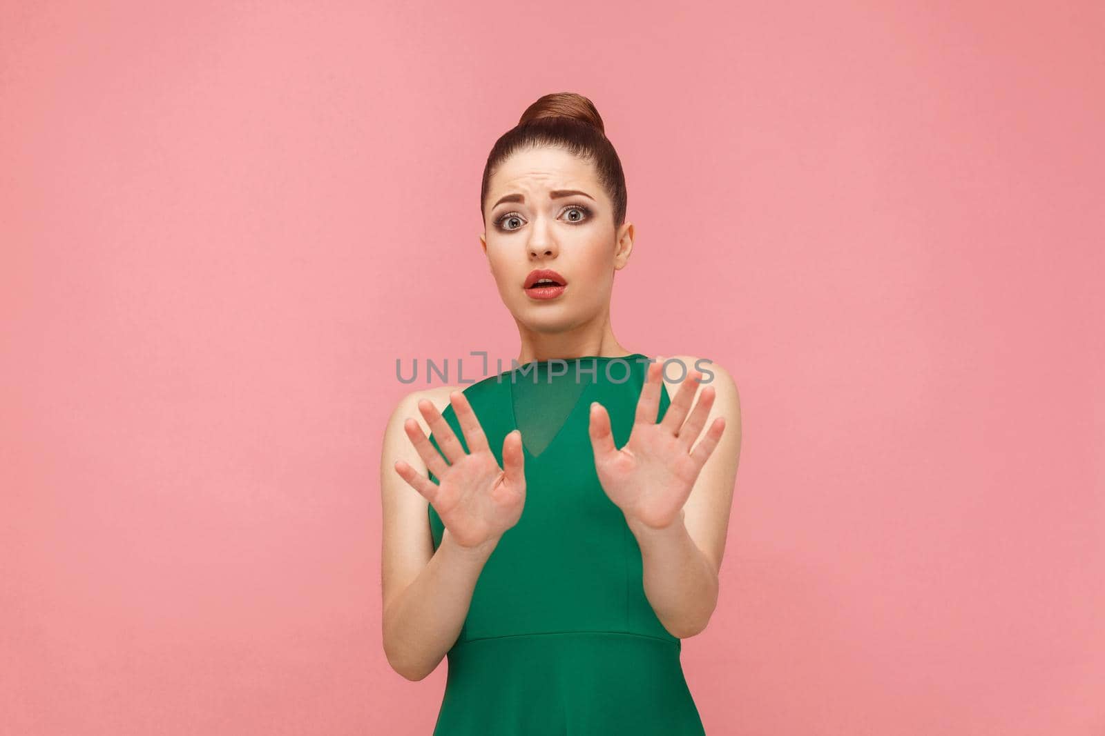 No! Fear reaction of beautiful woman . Expression emotion and feelings concept. Studio shot, isolated on pink background