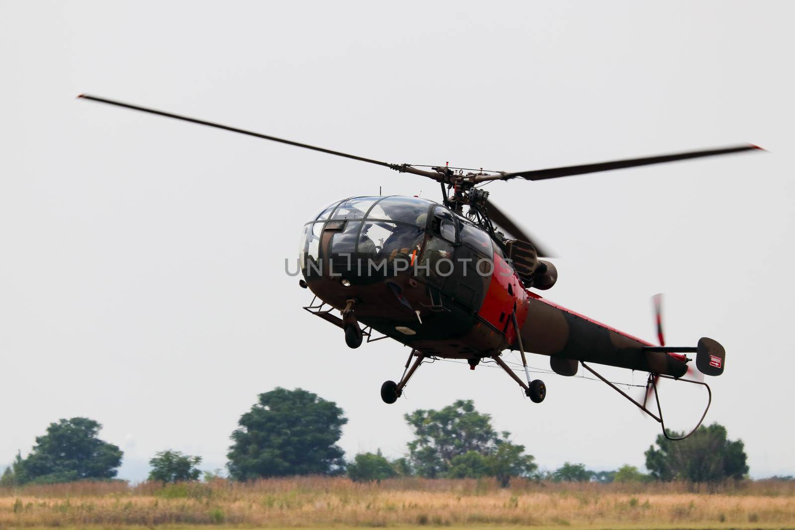 Light military utility helicopter approaching for landing, South Africa