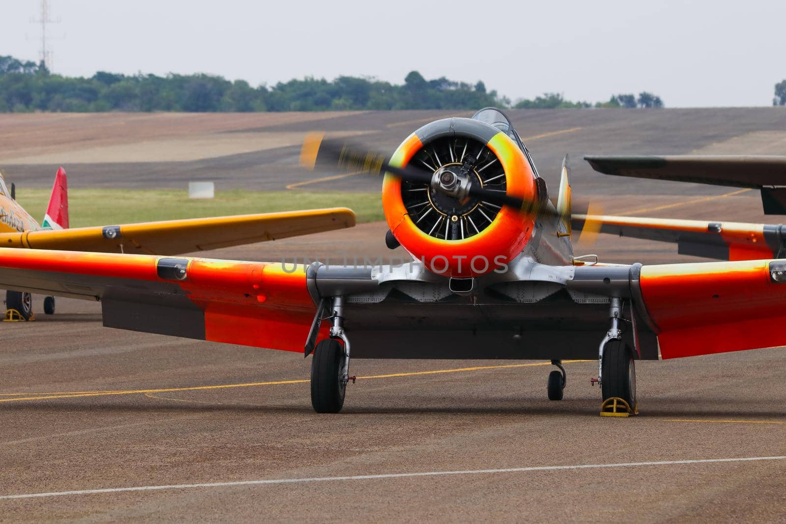 Classic aerobatic aircraft at airport with engine running, South Africa