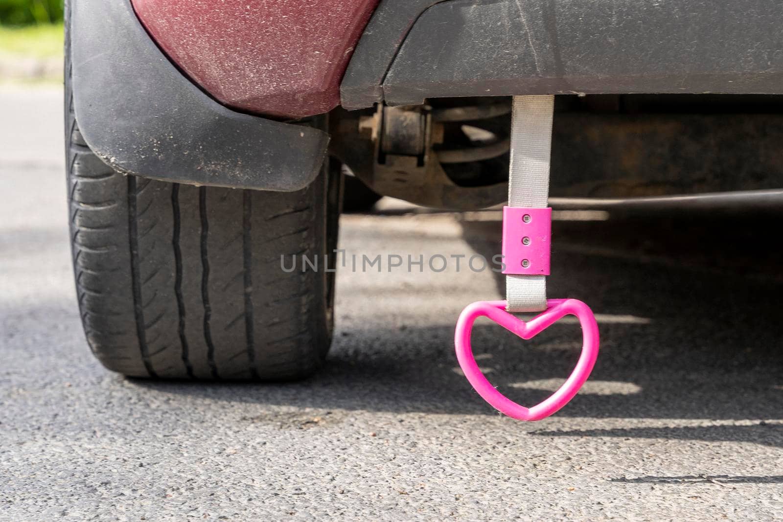 pink heart hanging on a rope on the back of the car by audiznam2609
