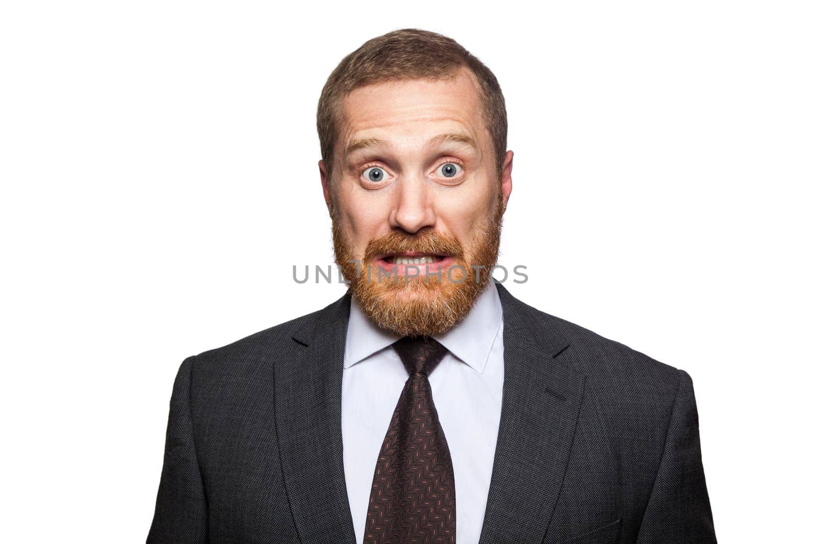 Shocked surprised businessman looking at camera with big eyes. isolated on white, looking at camera.