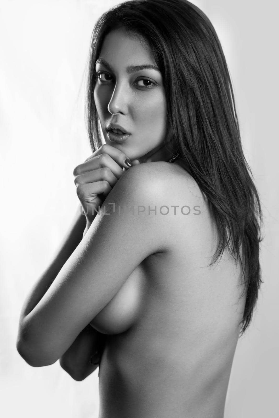 sensual young naked model alluringly looking at camera isolated on white background by Khosro1