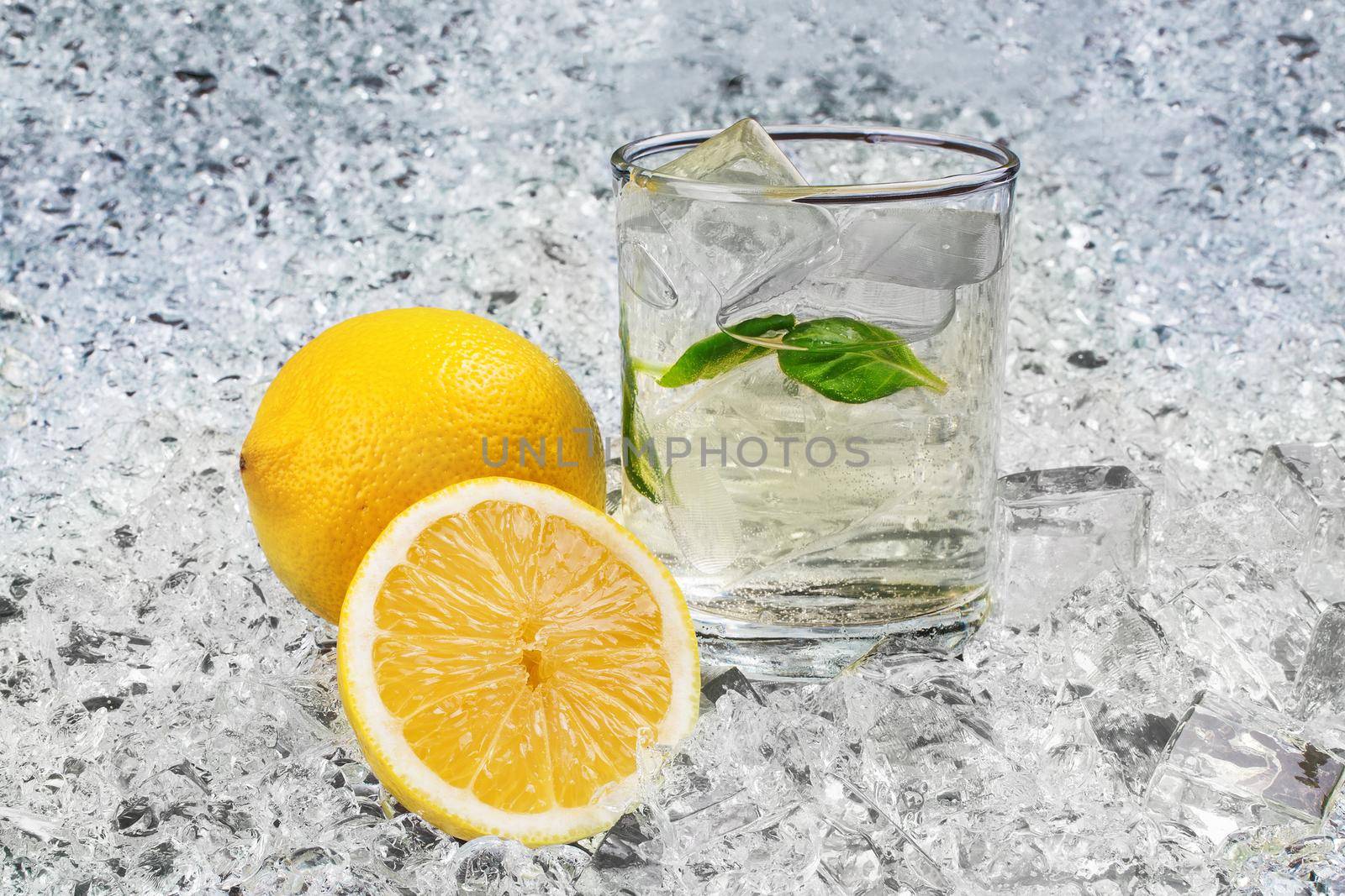 Refreshing lemonade with ice and lemon. Stock image.