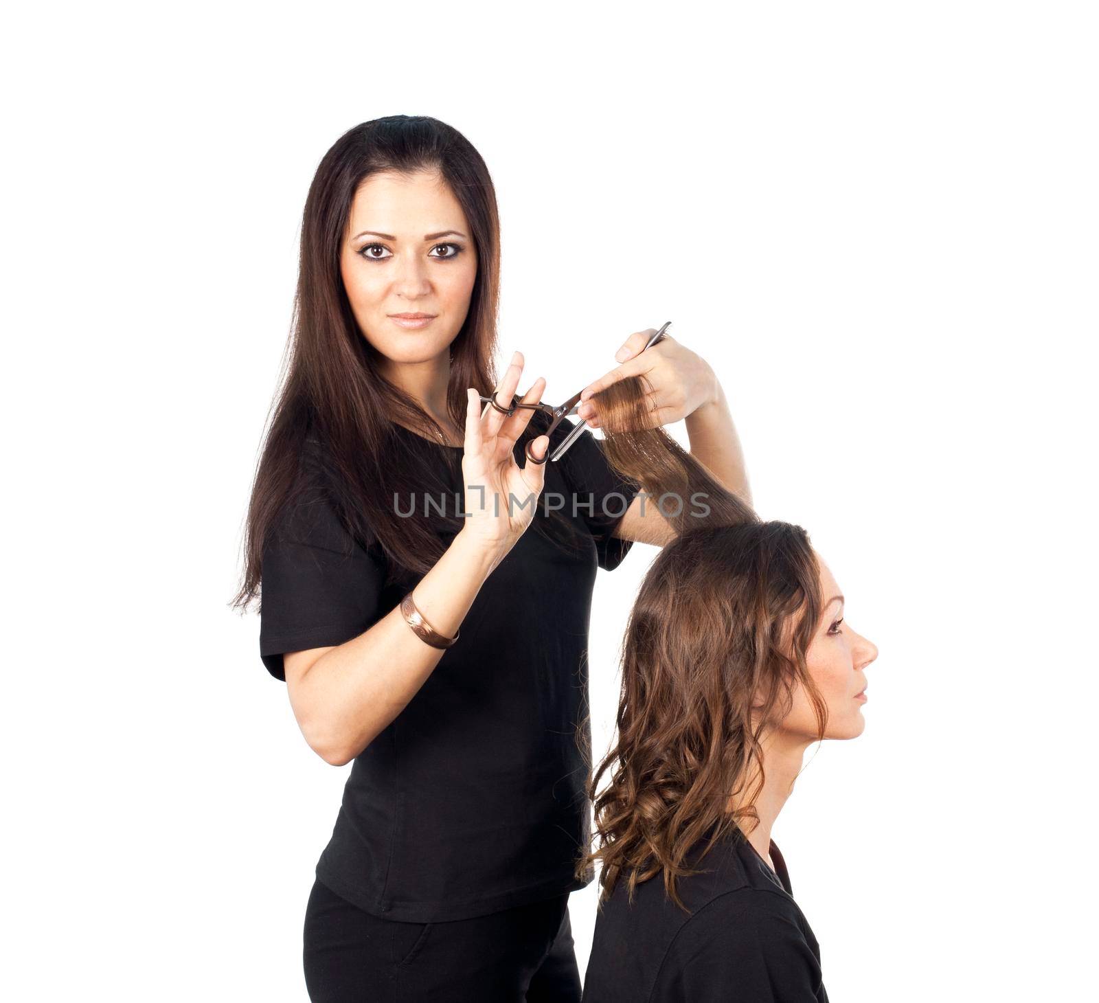 Beautiful woman has cutting hair at the hairdresser by Jyliana