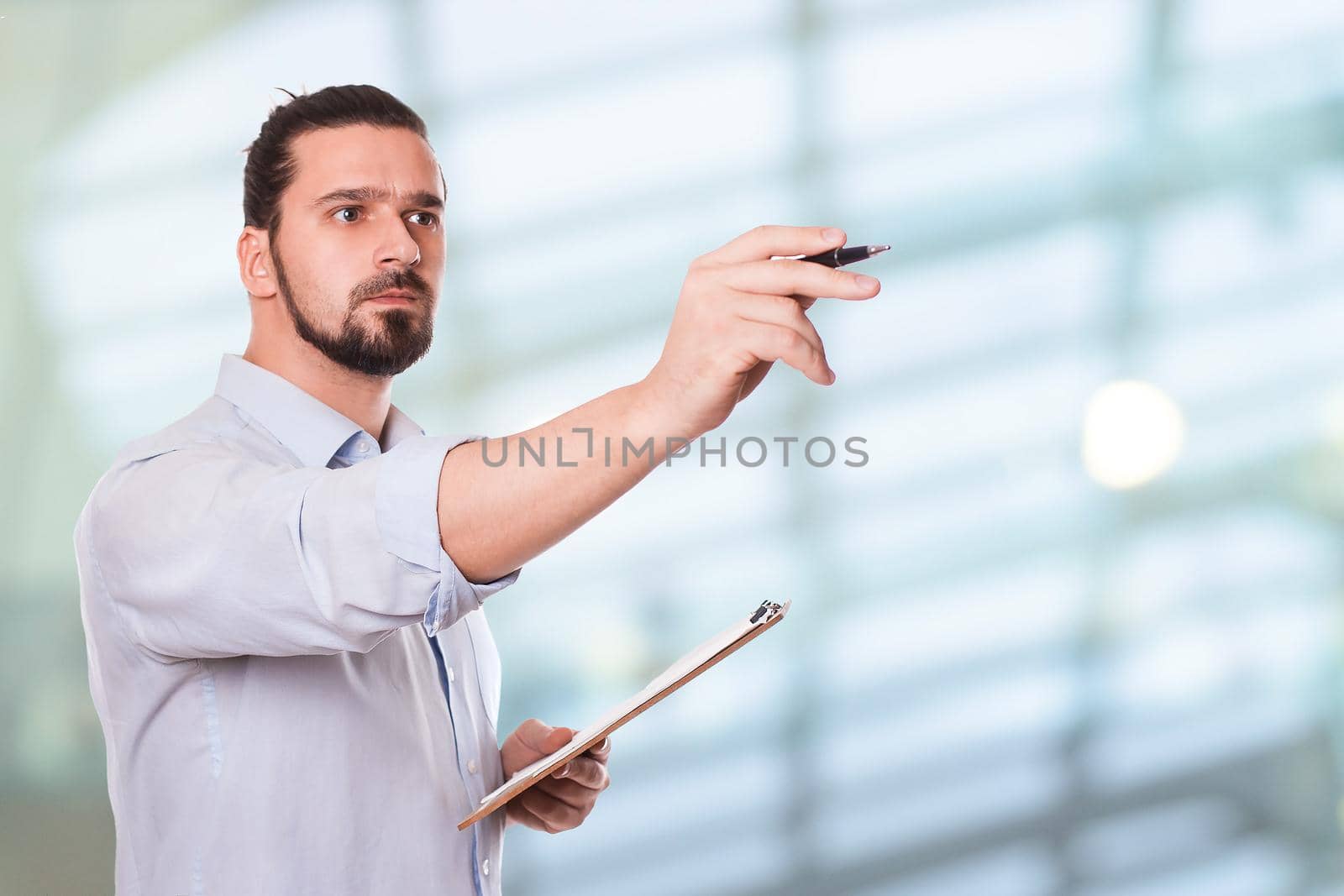 Businessman Writing on a Clipboard. Stock image