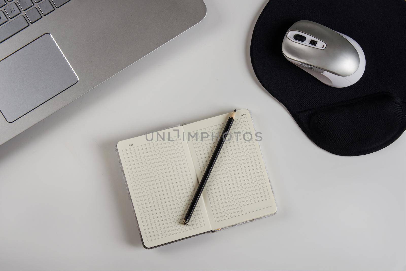 laptop on a white table. Stock image.