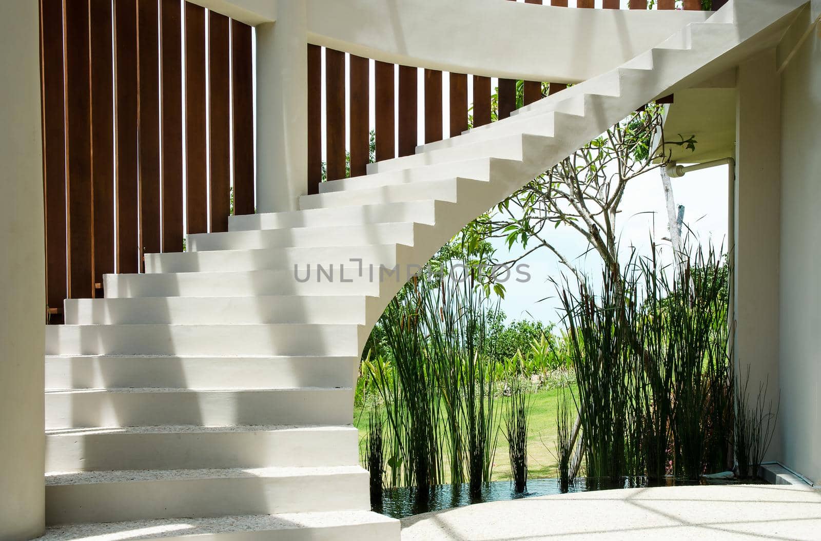 White spiral staircase overlooking the street. Stock image