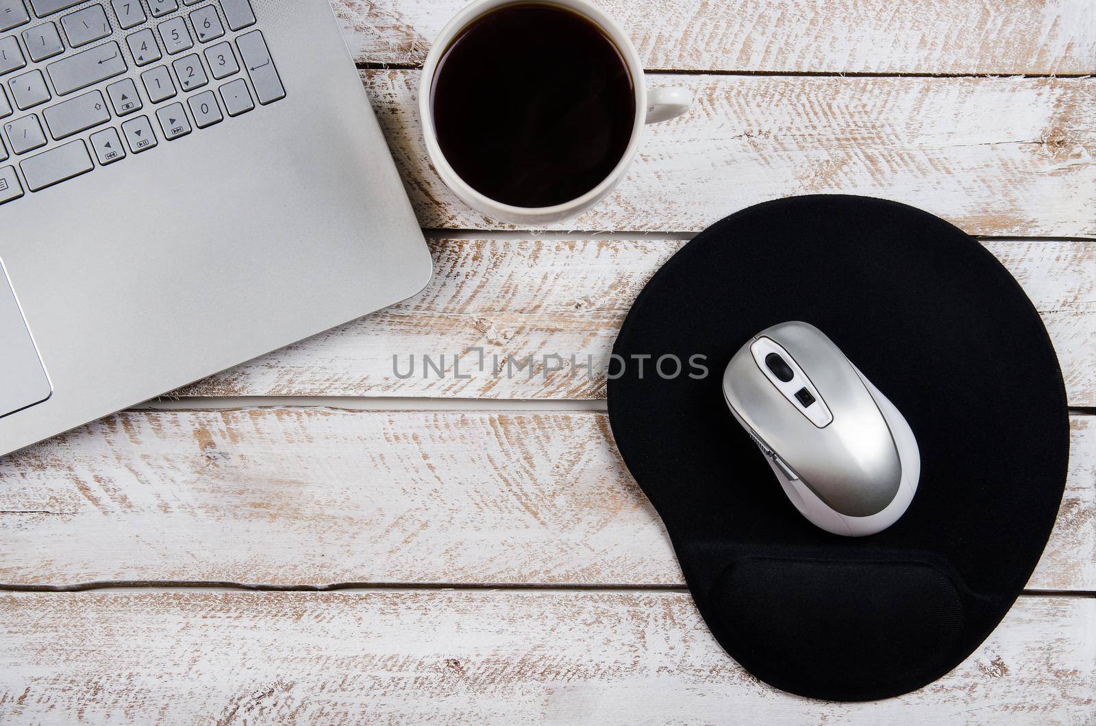 Coffee table with laptop and notebook by Jyliana