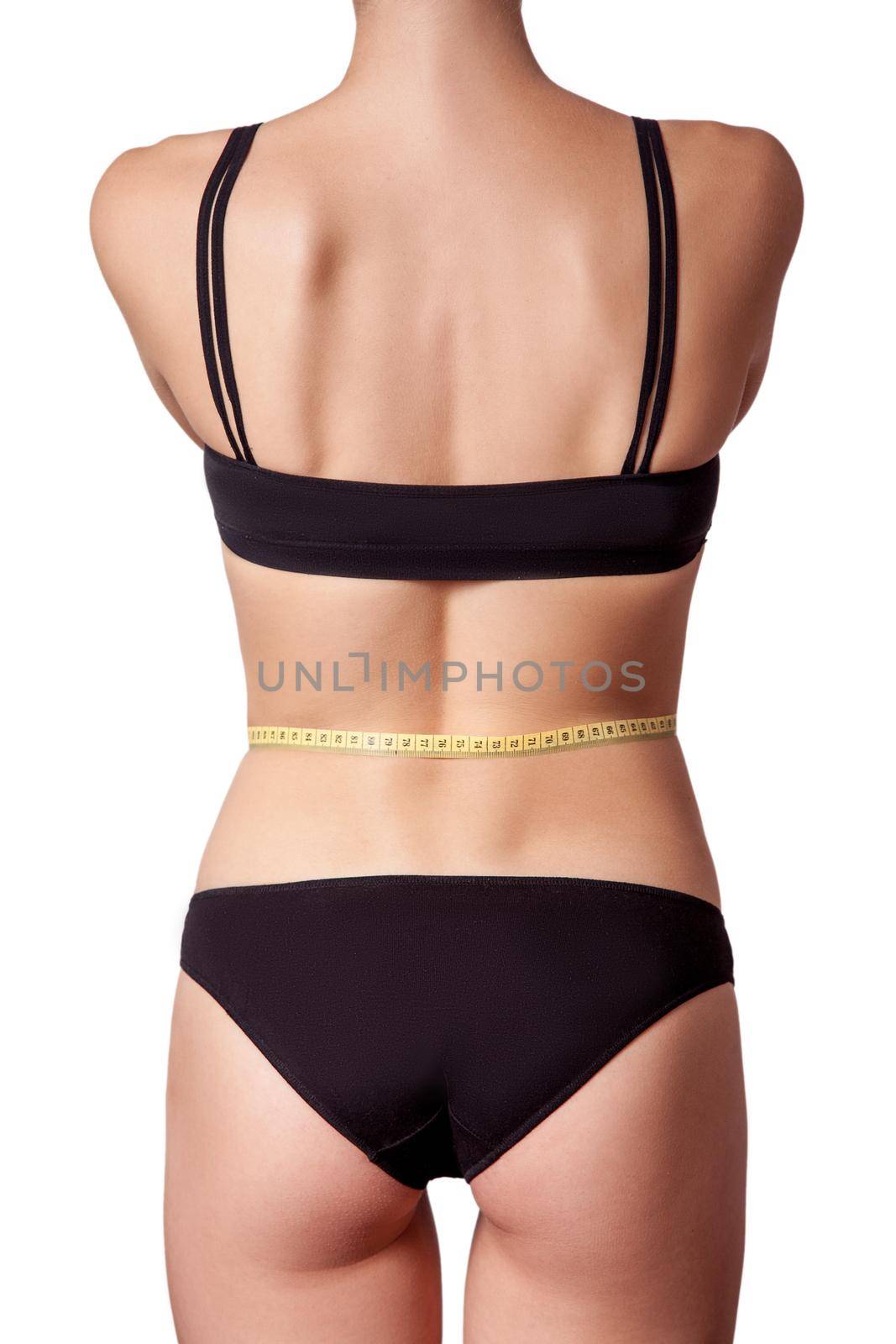 Slim fit happy young woman with measure tape measuring her waist with black underwear by Khosro1