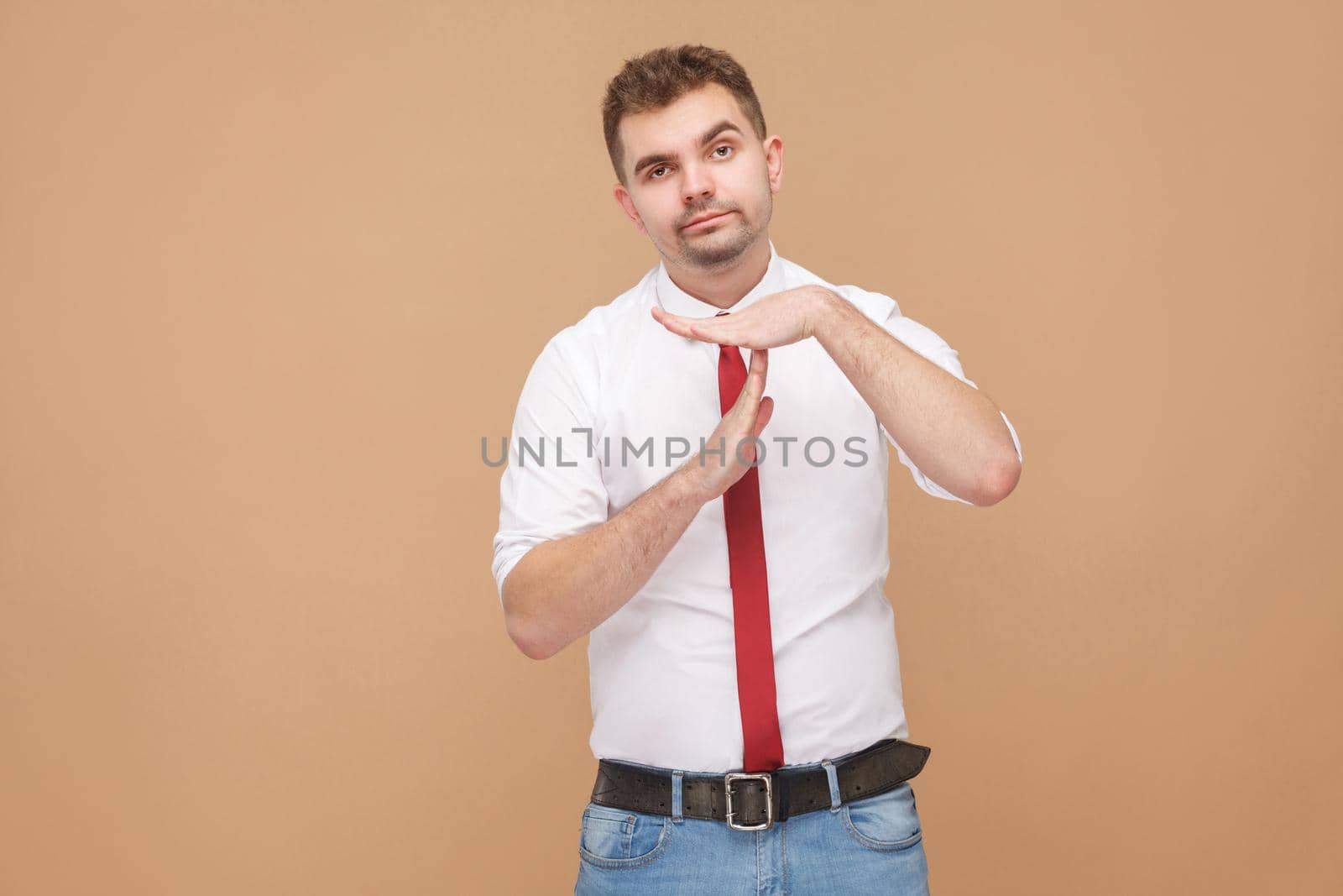 Business man need time out in work. Business people concept, good and bad emotion and feelings. Studio shot, isolated on light brown background