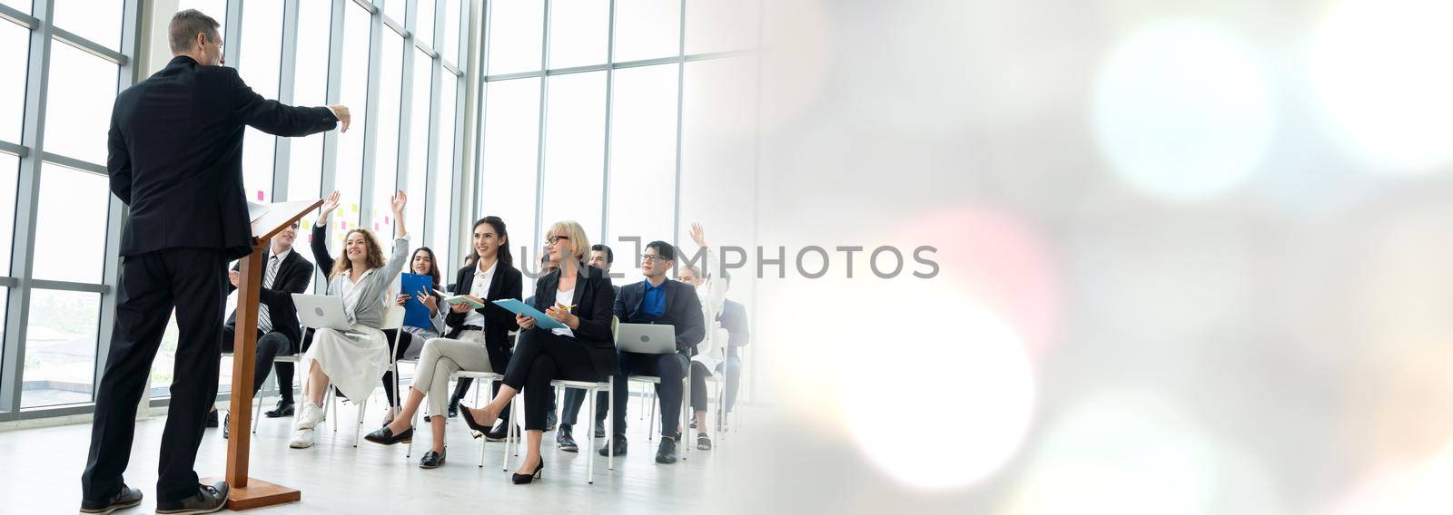 Group of business people meeting in a seminar conference widen view by biancoblue