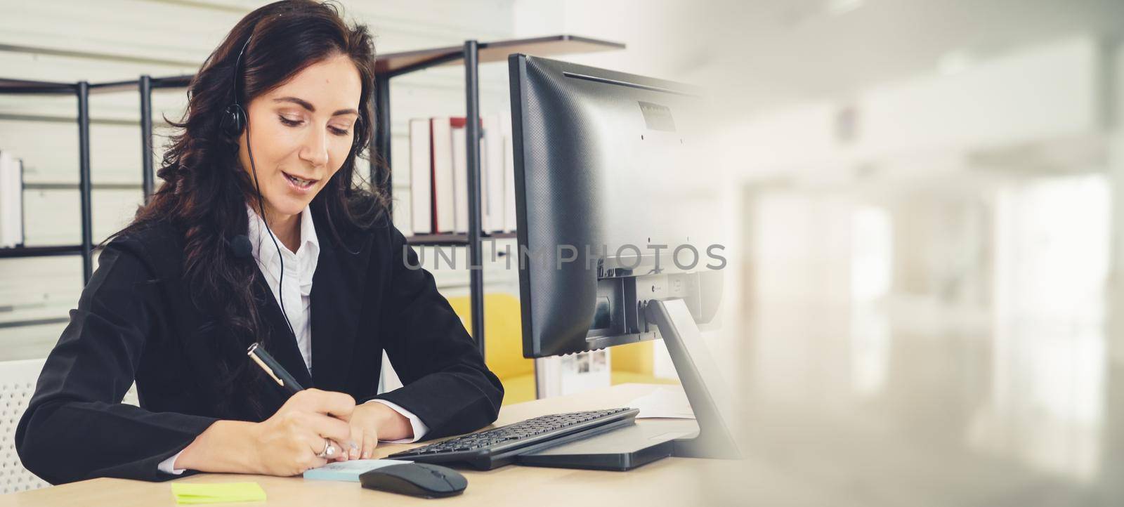 Business people wearing headset working in office to support remote customer or colleague. Call center, telemarketing, customer support agent provide service in broaden view .