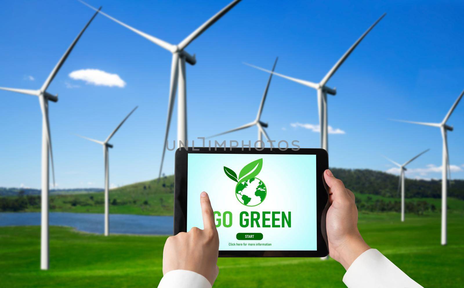 Green business transformation for environment saving and ESG business concept. Businessman using tablet to set corporate goal toward environmental friendly management and alternative clean energy use.