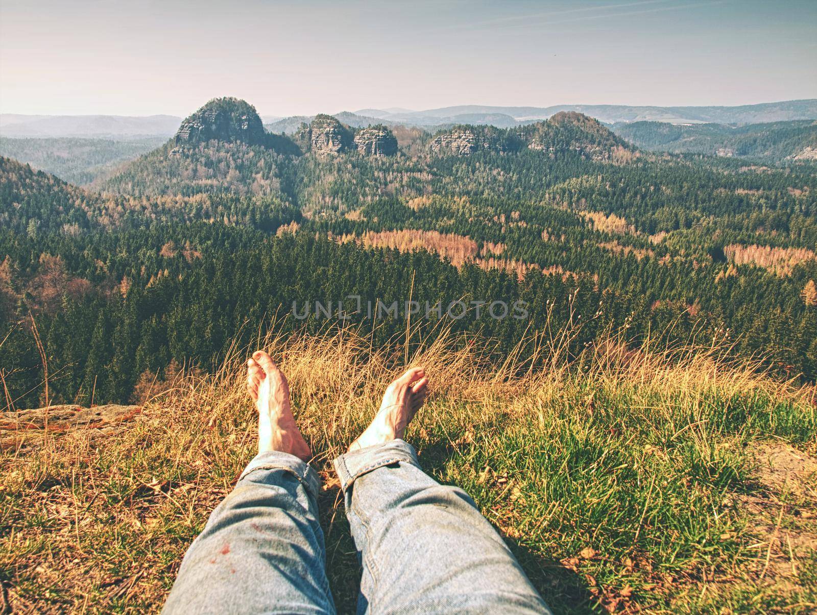 Tired hikers legs without shoes. Traveler relaxing  by rdonar2