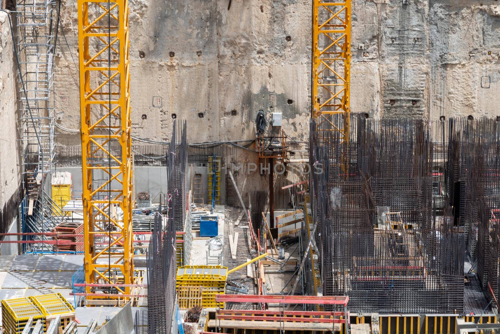 Construction site background. Hoisting cranes and new multi storey buildings. Industrial background. Close Up of Somail complex in Tel Aviv Construction work on the new Tel Aviv Municipality building by avirozen