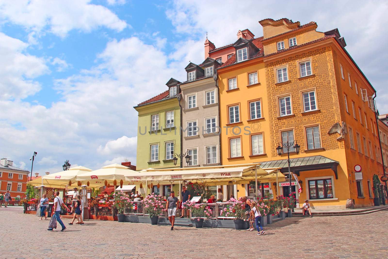 Tourists travel through old Warsaw. People rest in the center of old Warsaw by alexmak