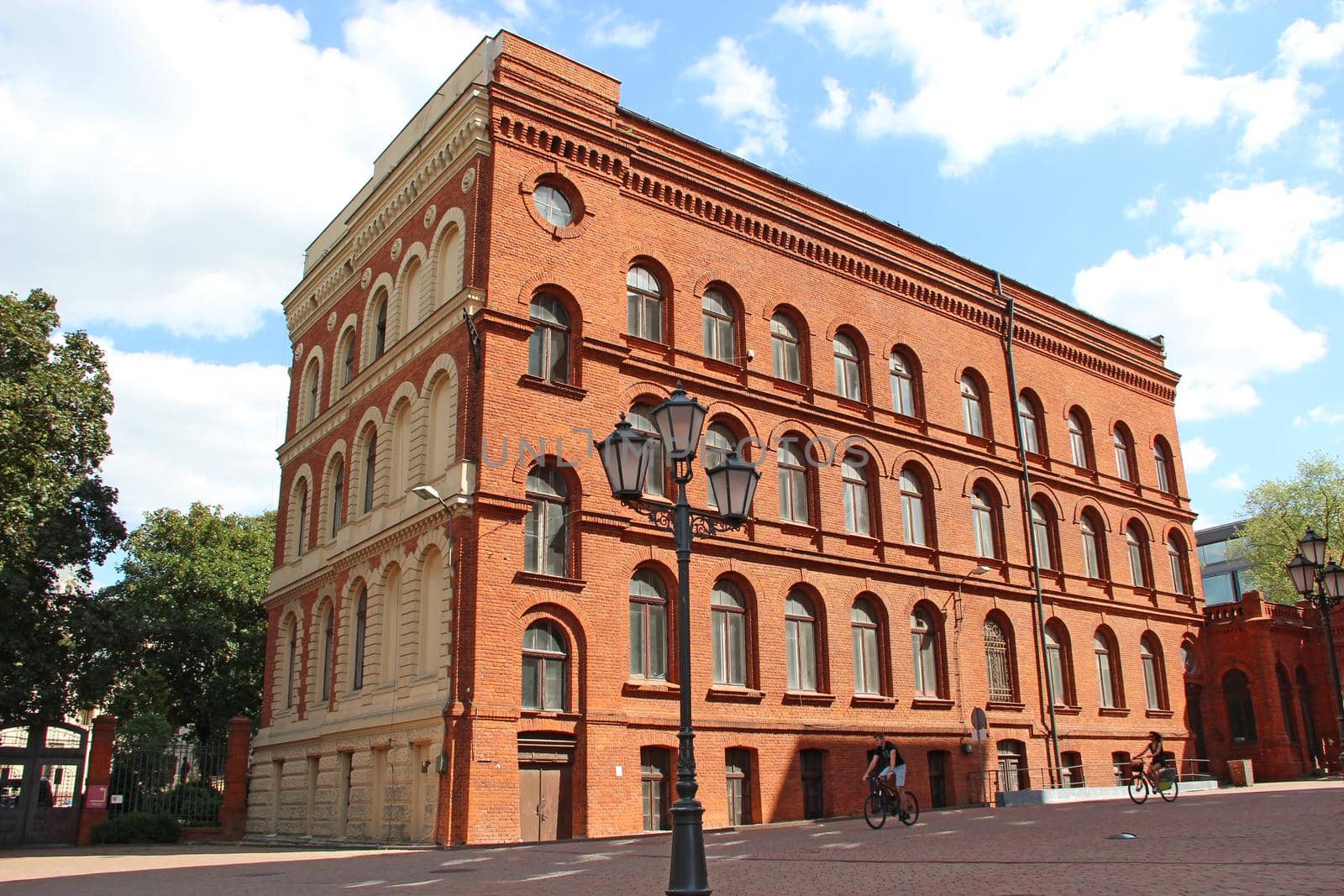 Facade of red brick factory building. Old factory in Lodz by alexmak