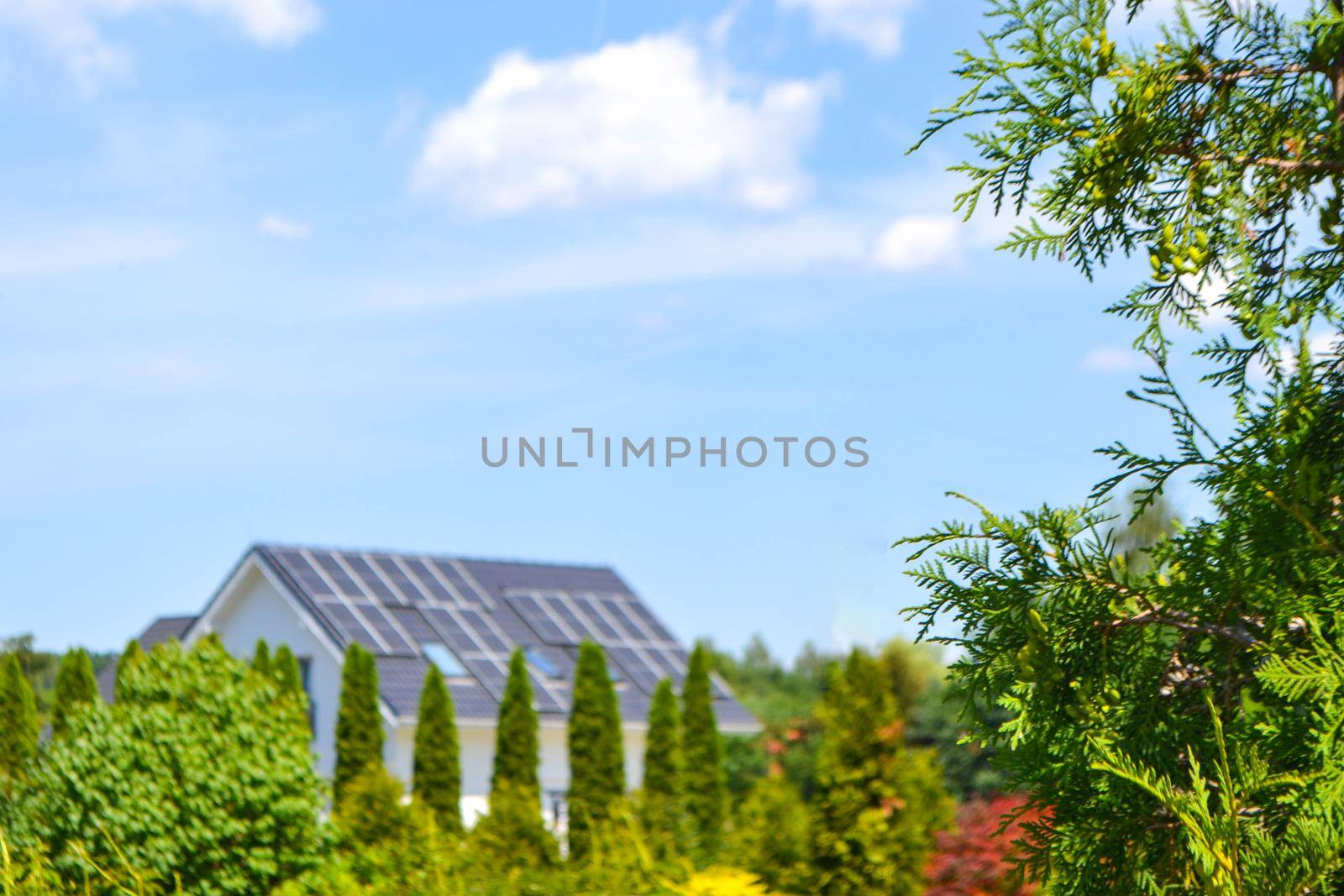 Historic farm house with modern solar panels on roof and wall High quality photo