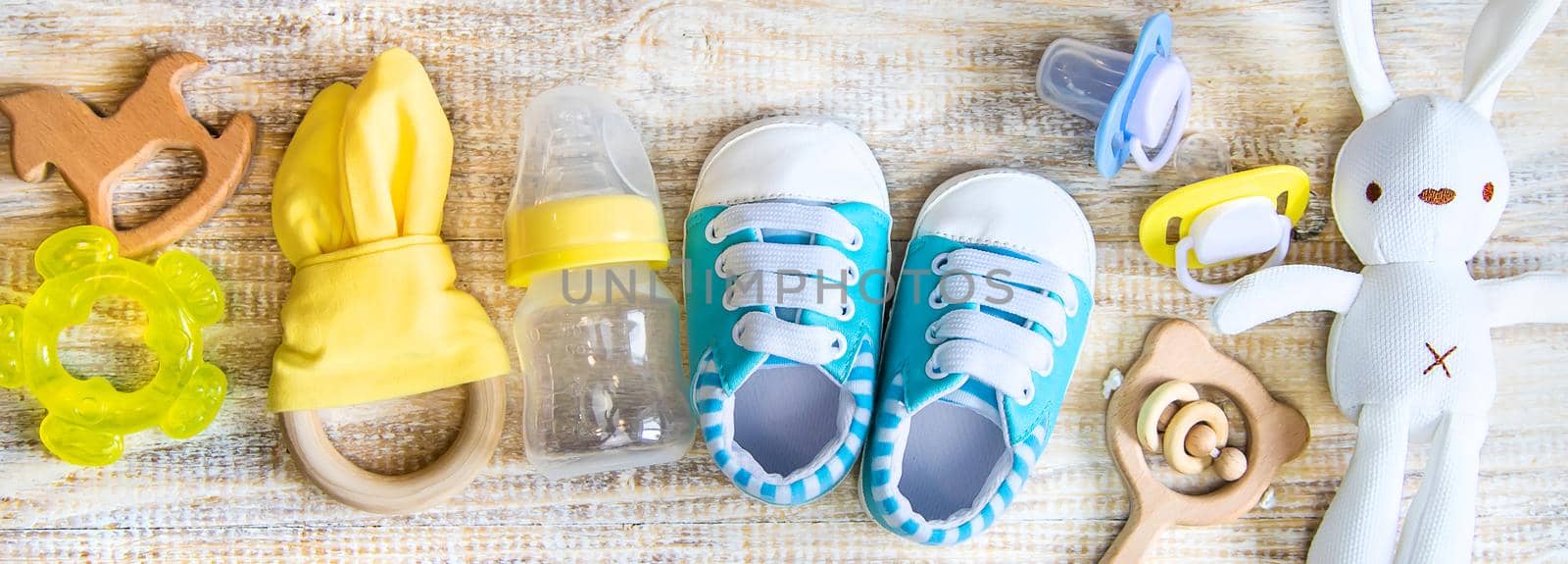 Baby clothes and accessories on a light background. Selective focus. nature.