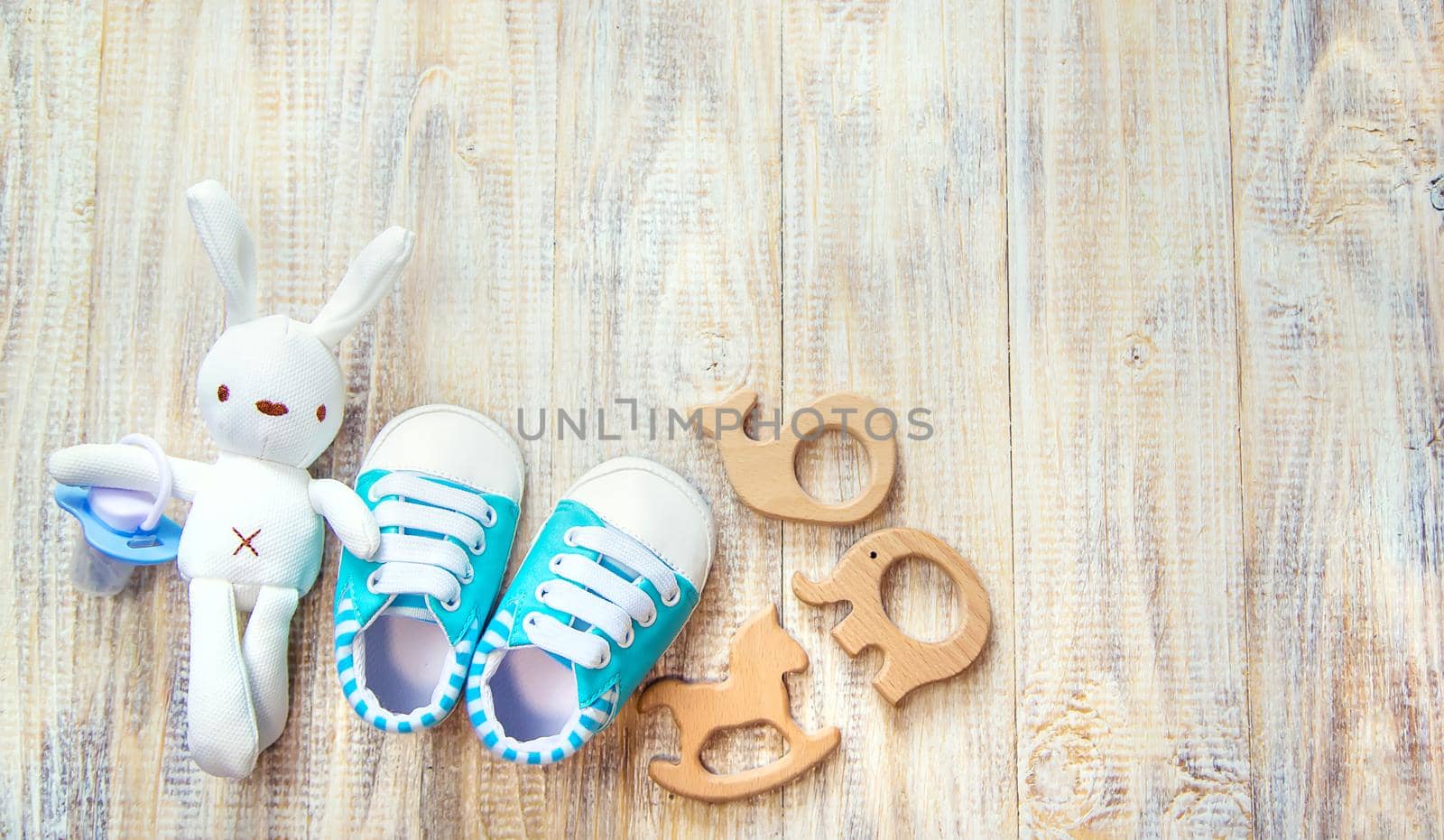 Baby clothes and accessories on a light background. Selective focus. nature.