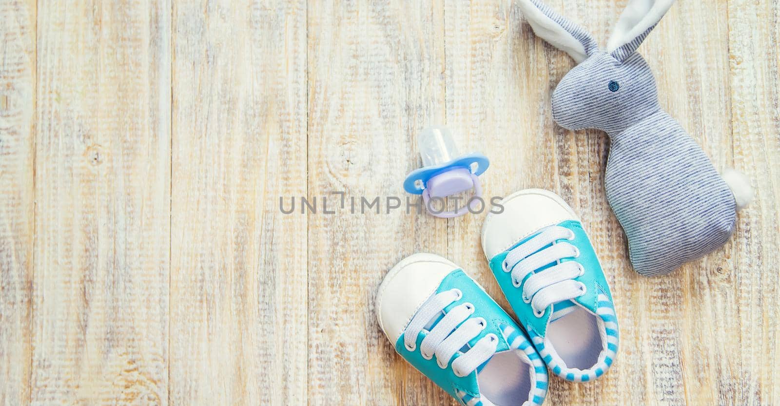 Baby clothes and accessories on a light background. Selective focus. nature.