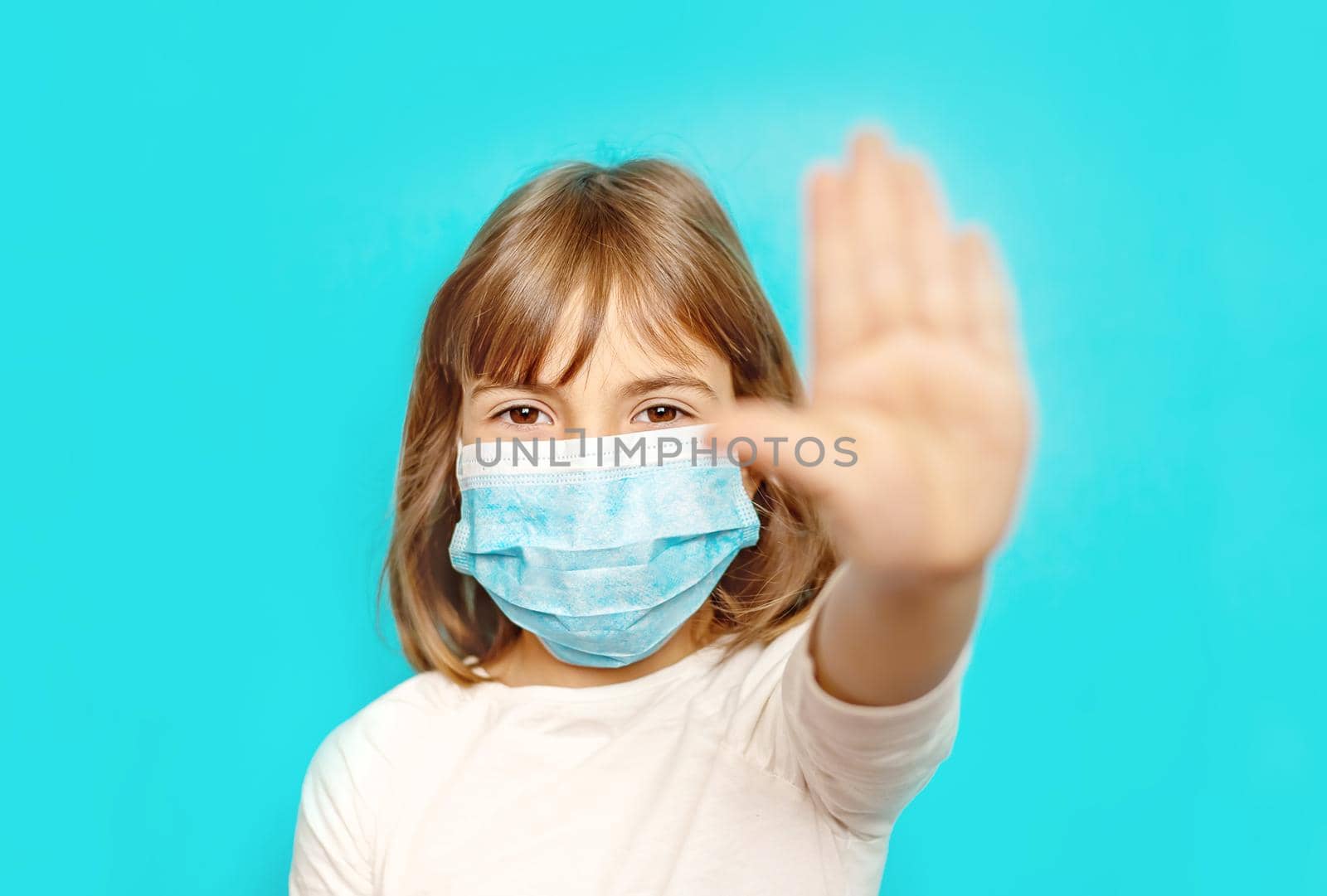 Masked child protection against virus. Selective focus.
