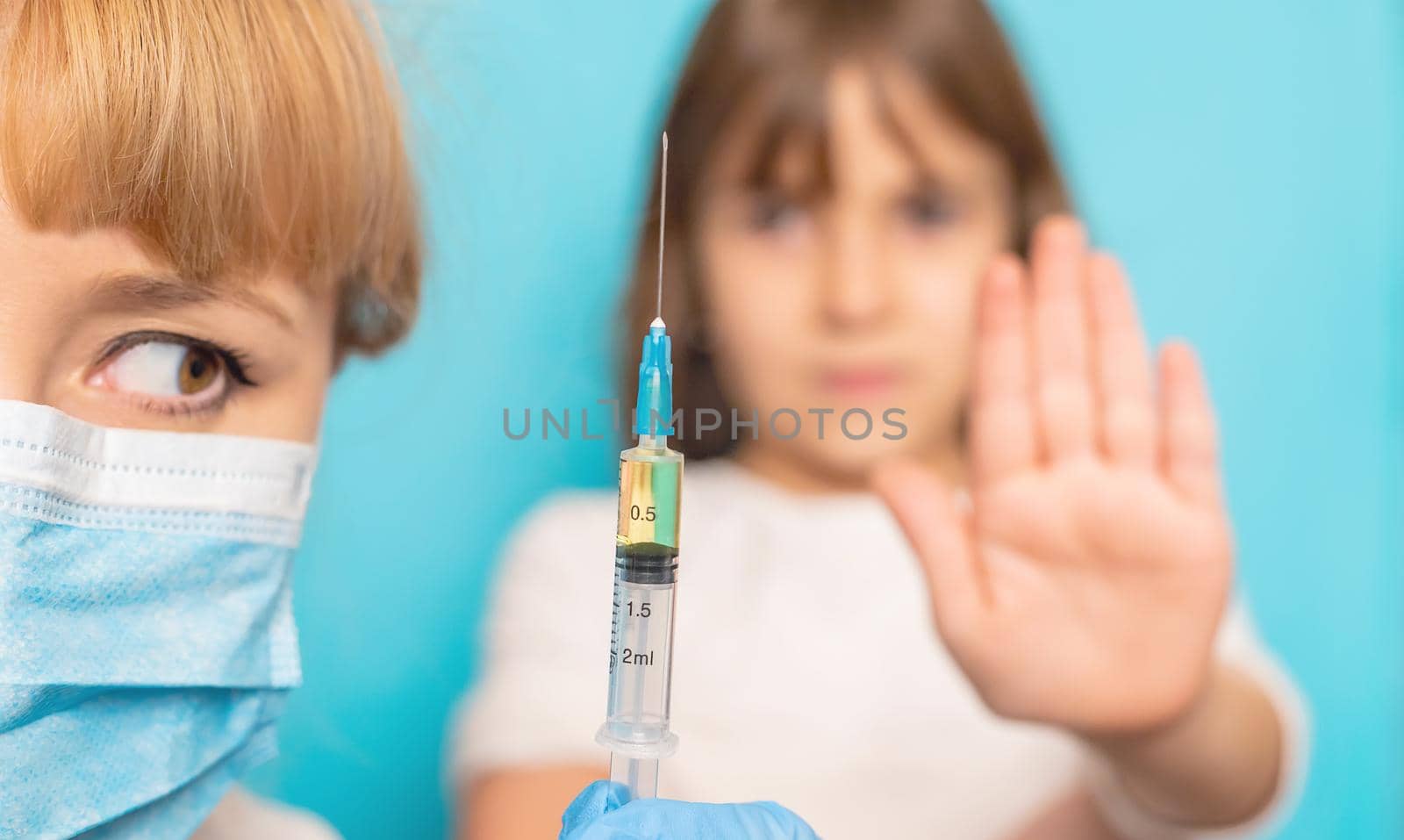 The child is injected into the arm. Selective focus.
