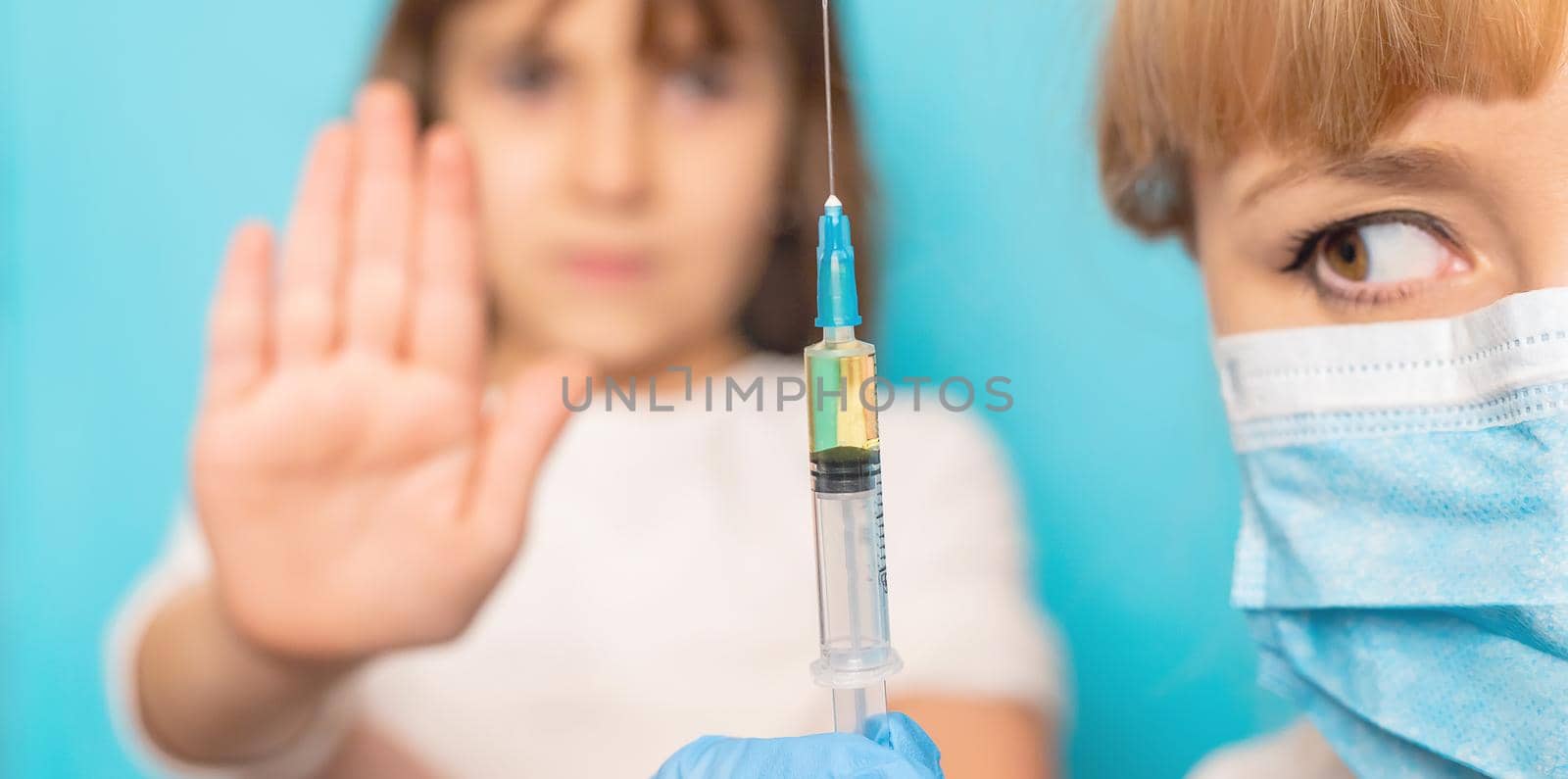 The child is injected into the arm. Selective focus.