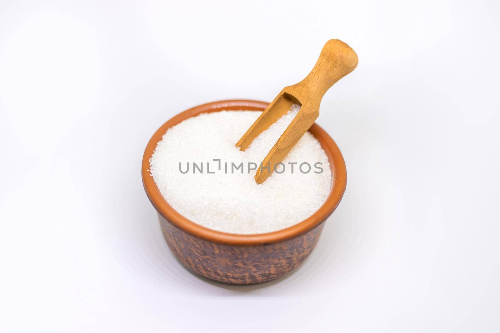 White sugar on a white isolated background. Selective focus. food.