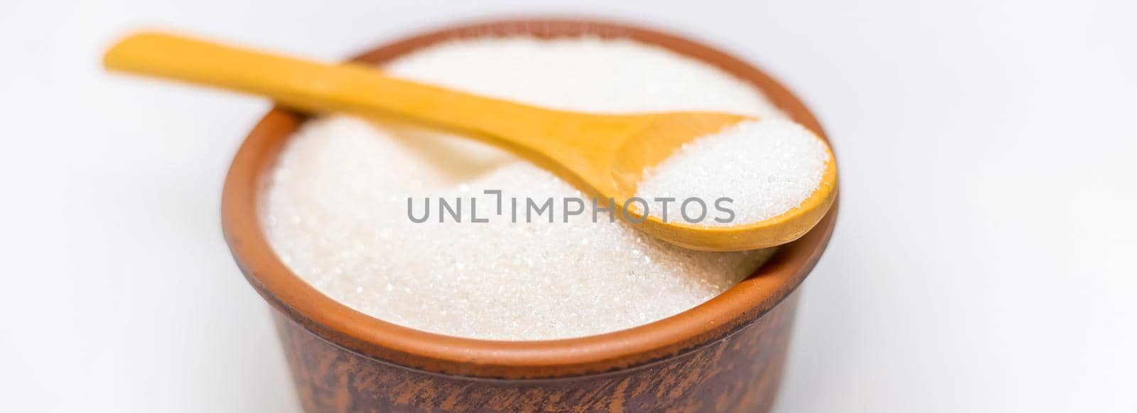 White sugar on a white isolated background. Selective focus. food.